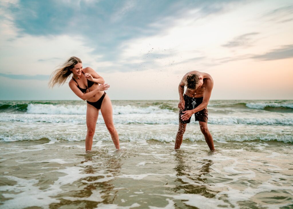Couple-splashing-in-ocean-beach-photoshoot