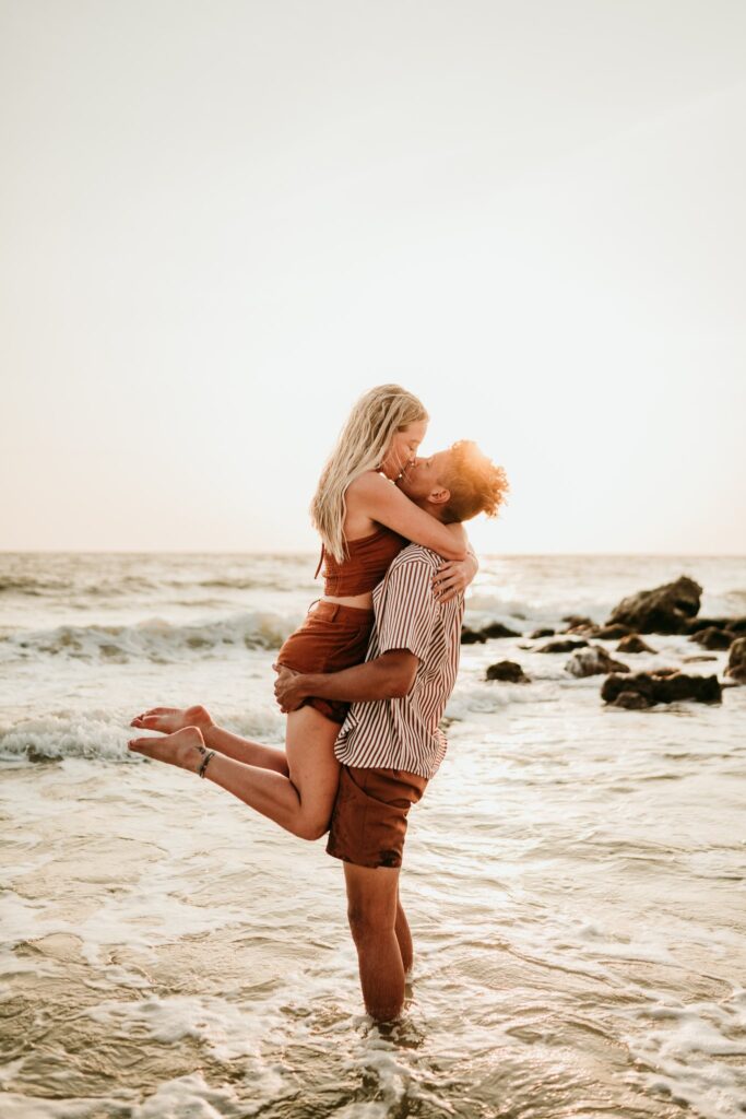 Couple-kissing-beach-portraits-chasing-creative