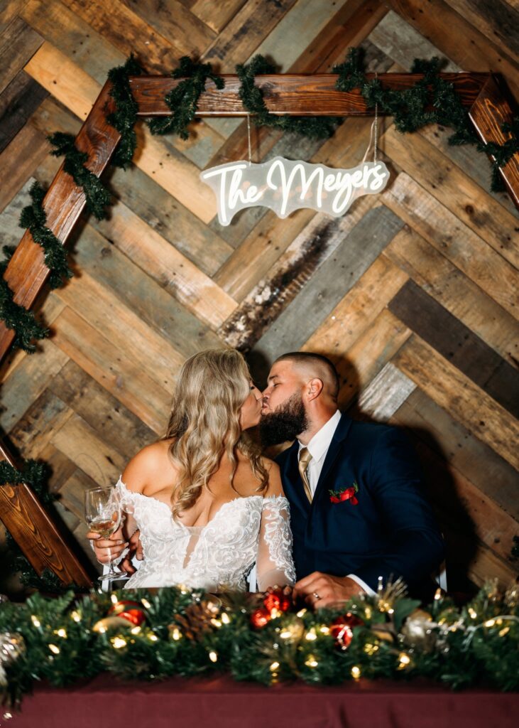 bride-and-groom-kissing-at-wedding-reception